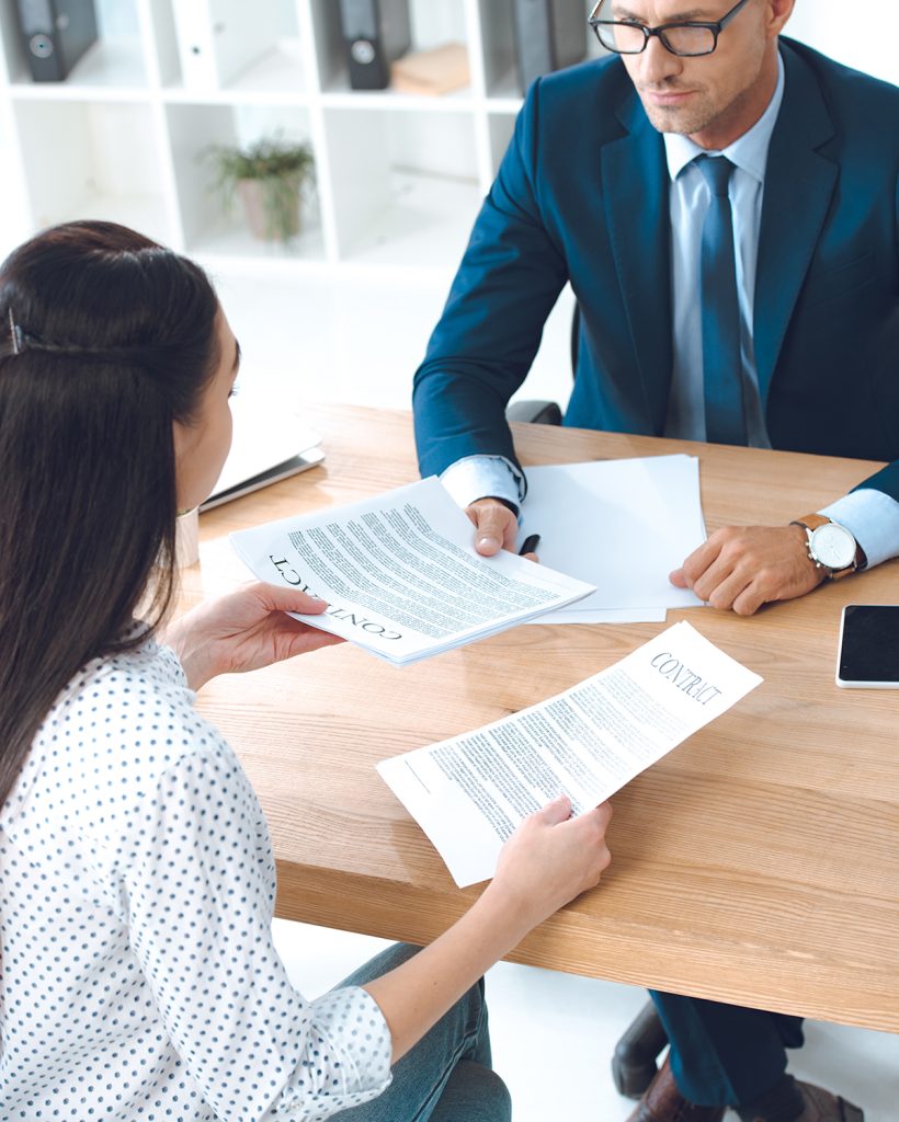 high-angle-view-of-lawyer-and-client-discussing-co-2021-08-31-14-46-03-utc high-angle-view-of-lawyer-and-client-discussing-co-2021-08-31-14-46-03-utc